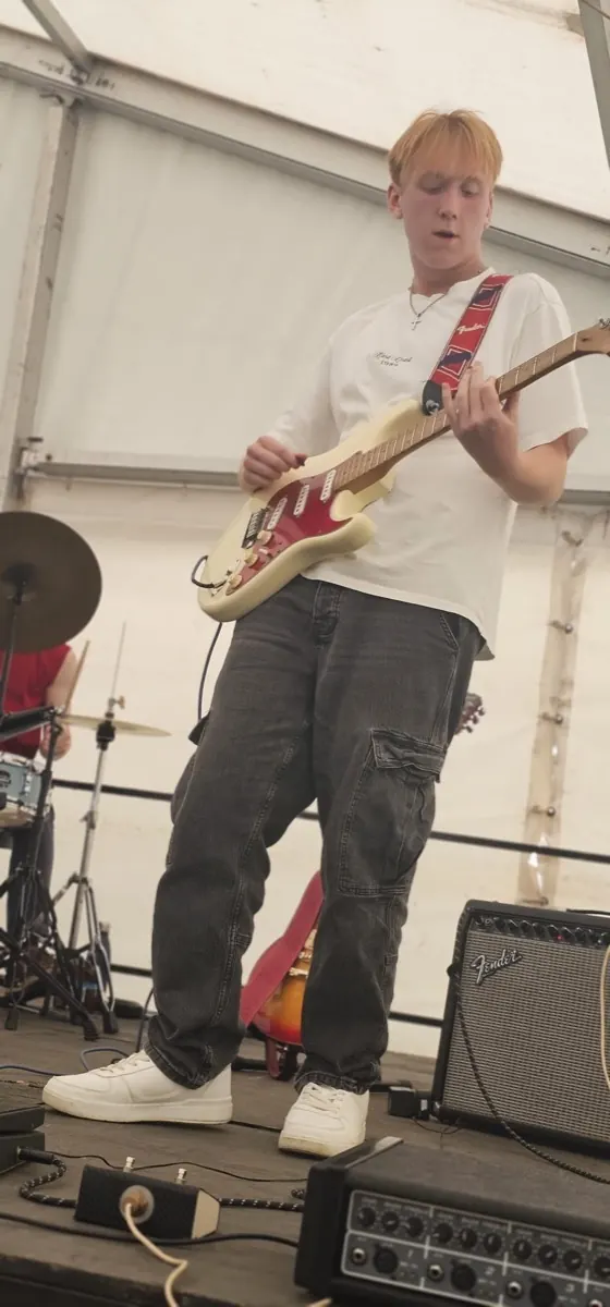 Lead guitar mid solo on the festival marquee stage